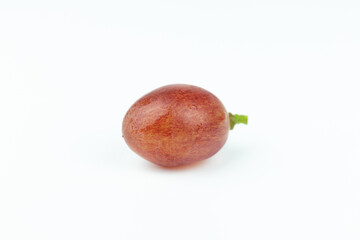A fresh raisin on a white background