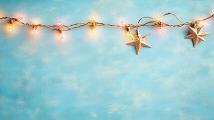 Glittering fairy lights and gold stars on a pastel blue background.