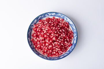 The pomegranate pulp pieces on the plate
