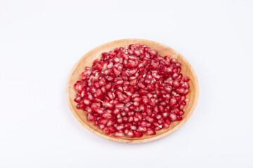 The pomegranate pulp pieces on the plate
