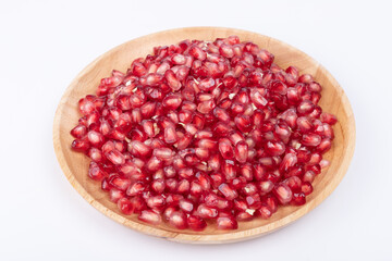 The pomegranate pulp pieces on the plate