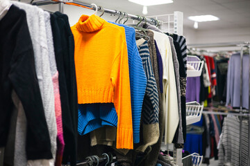 Obraz premium Clothing on hangers in the second-hand, sustainable, zero waste wardrobe.