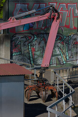 Industrial power meets precision—this rugged, red hydraulic claw is engineered for heavy-duty grabbing with gritty urban edge and mechanical artistry.