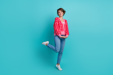 Full size photo of attractive young woman girlish posing dressed stylish red clothes isolated on aquamarine color background