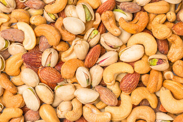Close-up of roasted nuts, including cashews, almonds, and pistachios.