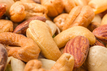 Close-up of roasted nuts, including cashews, almonds, and pistachios.