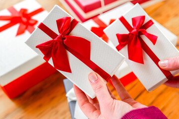Birthday gifts.Close-Up of Wrapped Gifts on a Wooden Table.Festively Wrapped Gift Boxes on Wooden...