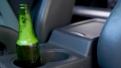 Do not drink alcohol or beer in a car. It is dangerous for drivers on the road.