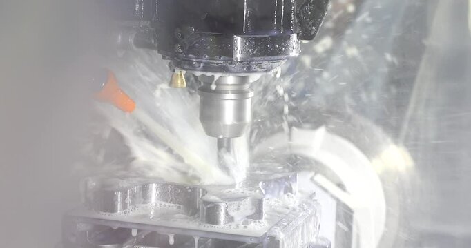 4k slow motion video of CNC turning drill milling factory process a piece o steel during a demonstration. Metal machine tools industry. Selective focus.
