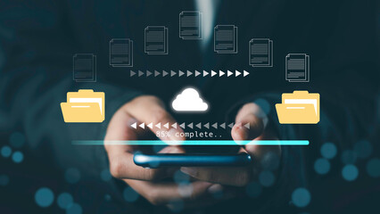 Hands holding smartphone with cloud file upload interface, symbolizing data transfer, cloud storage, file sharing, and digital technology.