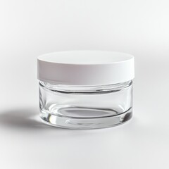 A clear glass jar with a white plastic lid sits on a white background; simple, cylindrical design