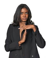 Young Indian woman in business suit showing a timeout gesture.