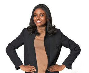 Plakat Young Indian woman in business suit confident keeping hands on hips.
