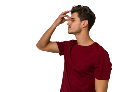 Young handsome caucasian man isolated on white background having a head ache, touching front of the face.