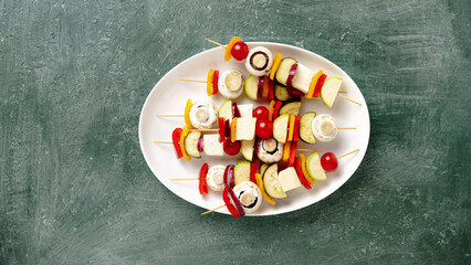 various fresh vegetables on wooden skewers, vegan bbq preparation, vegetarian food, eating out