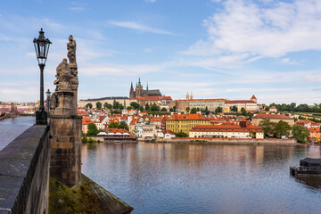 Beautiful view from the Charles Bridge of the historical buildings on the banks of the Vltava River 