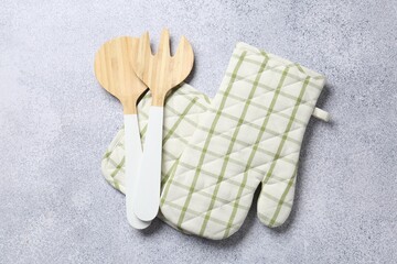 Different kitchen utensils on light table, flat lay
