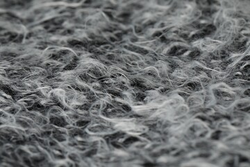 Texture of grey wool fabric as background, closeup