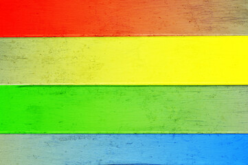Rainbow multi color on wooden plank background.