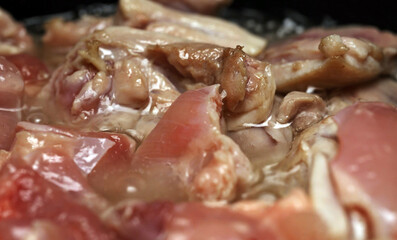 Frying Chicken Thighs in Oil for Pilaf.