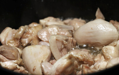 Frying Chicken Thighs in Oil for Pilaf.