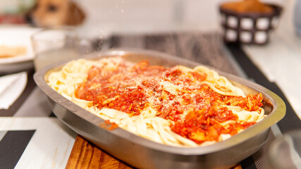 close view of homemade pasta served in a metal platter