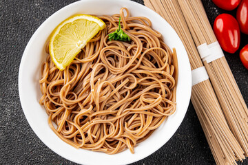 Buckwheat noodles soba in a bowl fresh dish Asian cuisine on the table rustic food top view copy space