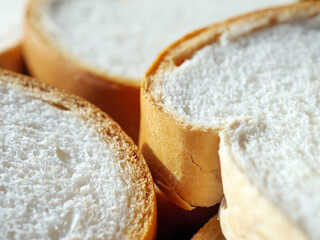 Close-up of freshly sliced ​​soft and fragrant bread with white bread,brown bread crust macro