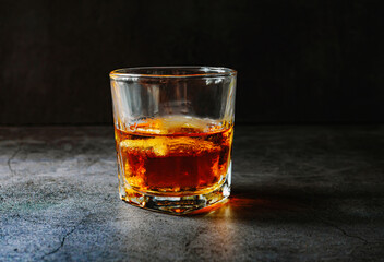 Strong alcohol drink. Whisky in glass with ice, Whisky, bourbon or cognac. Hard strong alcoholic...