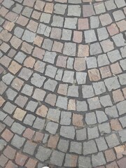 background. paving stones beautifully paved on the road.