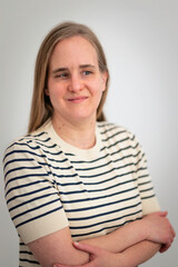 Obraz premium A visually impaired woman standing against white wall