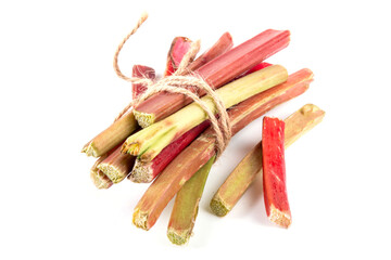 Raw fresh organic rhubarb stems on white background, bunch of homegrown pink and green rhubarb ready for cooking dish, dessert or jam. Summer harvest, cooking ingredient
