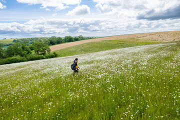 summer british outdoor landscape, backpacker walking on Combe, Kintbury, Berkshire, England.