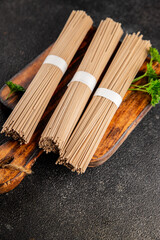 Buckwheat noodles raw soba fresh dish natural food Asian cuisine on the table rustic food top view copy space