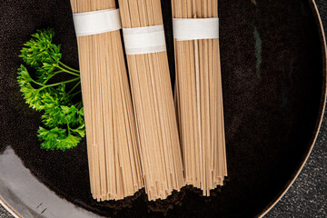 Buckwheat noodles raw soba fresh dish natural food Asian cuisine on the table rustic food top view copy space
