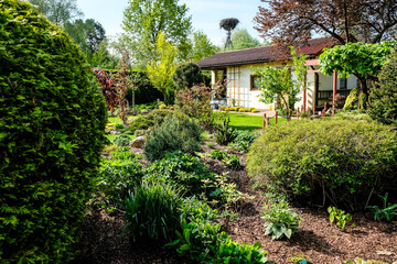A very beautiful garden house in a neat and tidy allotment in summer. Gardening, allotments, urban gardening