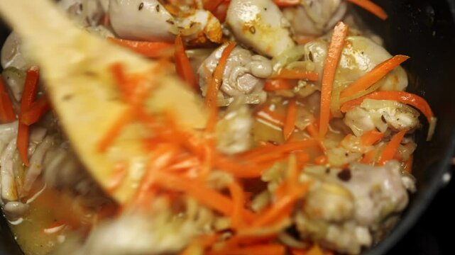 Frying Chicken and Carrots for Pilaf Preparation.