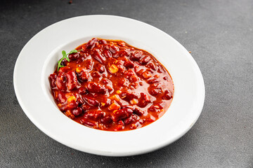 Chile con carne plate beans, tomato, corn, meat fresh delicious gourmet food background on the table rustic food top view copy space