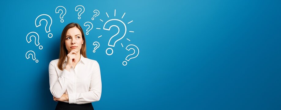 Thoughtful businesswoman looking up with question marks on a blue background representing confusion or decision-making concept in business.