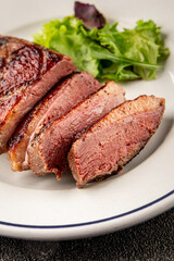 Duck breast roast meat poultry fresh delicious gourmet food background on the table rustic food top view copy space