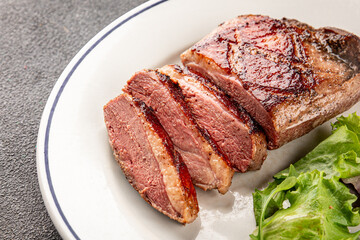 Duck breast roast meat poultry fresh delicious gourmet food background on the table rustic food top view copy space