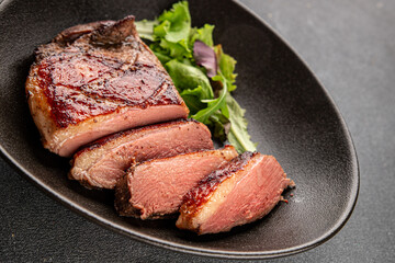 Duck breast roast meat poultry fresh delicious gourmet food background on the table rustic food top view copy space
