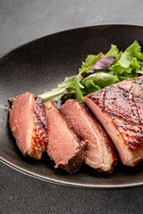 Duck breast roast meat poultry fresh delicious gourmet food background on the table rustic food top view copy space