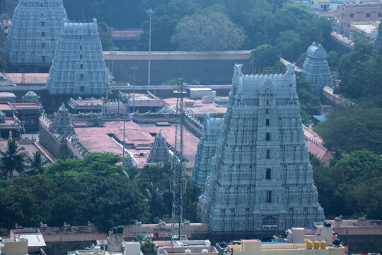 Aerial top view of colorful gopuram towers at Arunachaleswarar Temple in Tiruvannamalai, Tamil Nadu, India. Hindu sacred architecture, Dravidian style travel destination.