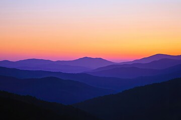 Fototapeta premium Mountain ranges bathed in sunset hues