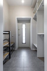 Modern Entryway with Tile Floor and Storage