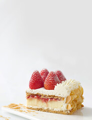 Strawberry and Cream Layered Pastry Slice with Fresh Berries and Almond Flakes