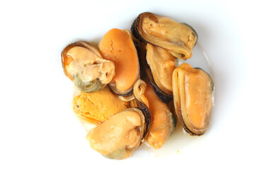 Fresh seafood delicacy featuring shelled mussels arranged on a white plate