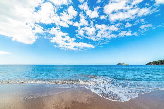 Fototapeta La Perle beach under a cloudy sky