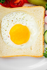 Fried gashouse eggs in bread egg in the basket delicious snack breakfast in a bowl fresh delicious gourmet food background on the table rustic food top view copy space